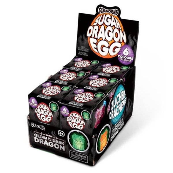 Box of Sugar Dragon Egg candy with colorful packaging on a white background.